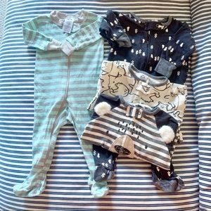 Four Gerber Sleep n Play outfits